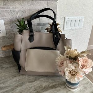 Nicole Miller Cream and Black Satchel with Structured Design